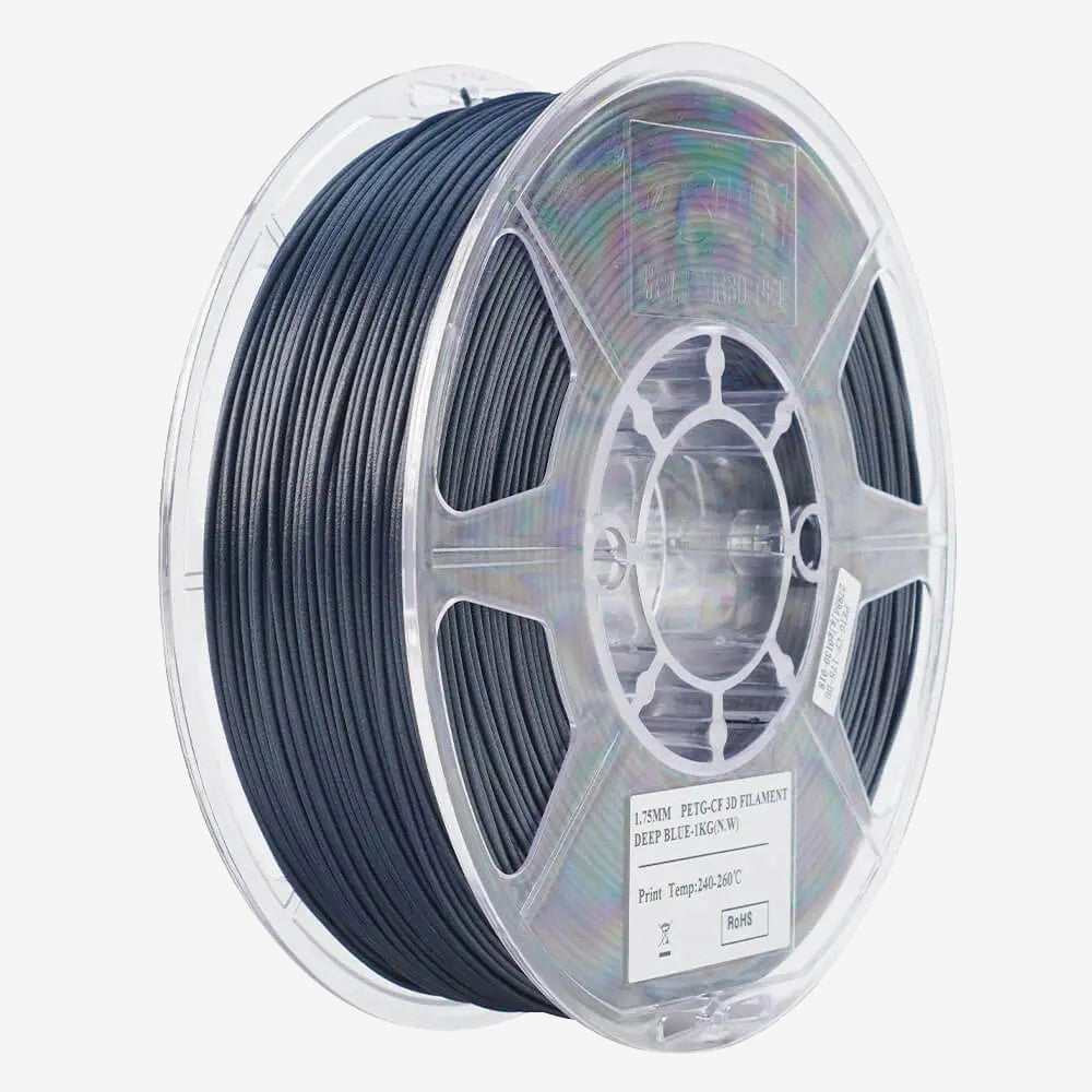 eSUN PETG-CF filament spool in deep blue, showing the Additronix brand label and the textured surface of the filament.