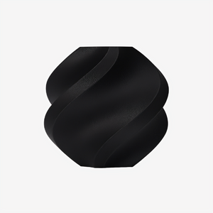 Additronix Bambu Lab PA6-CF black filament spool showing textured surface and labeling for 3D printing use