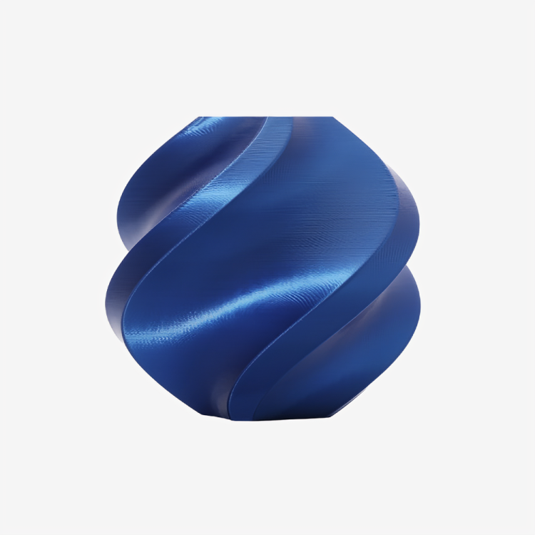 Blue Bambu Lab PLA Silk+ filament spool by Additronix, showcasing the smooth, shiny silk finish of the 3D printing material.