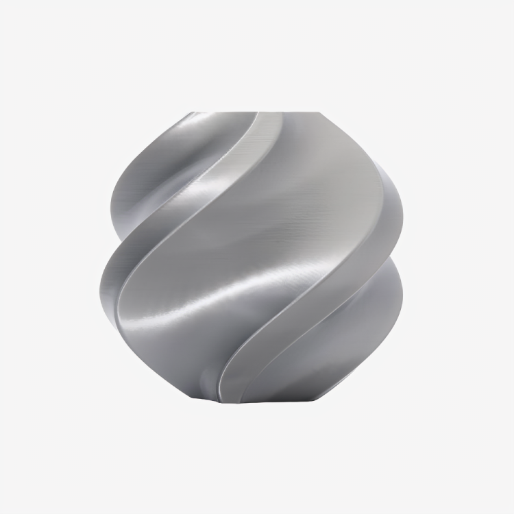 Silver Bambu Lab PLA Silk+ filament spool from Additronix, showcasing smooth, shiny 3D printing filament on a reel.