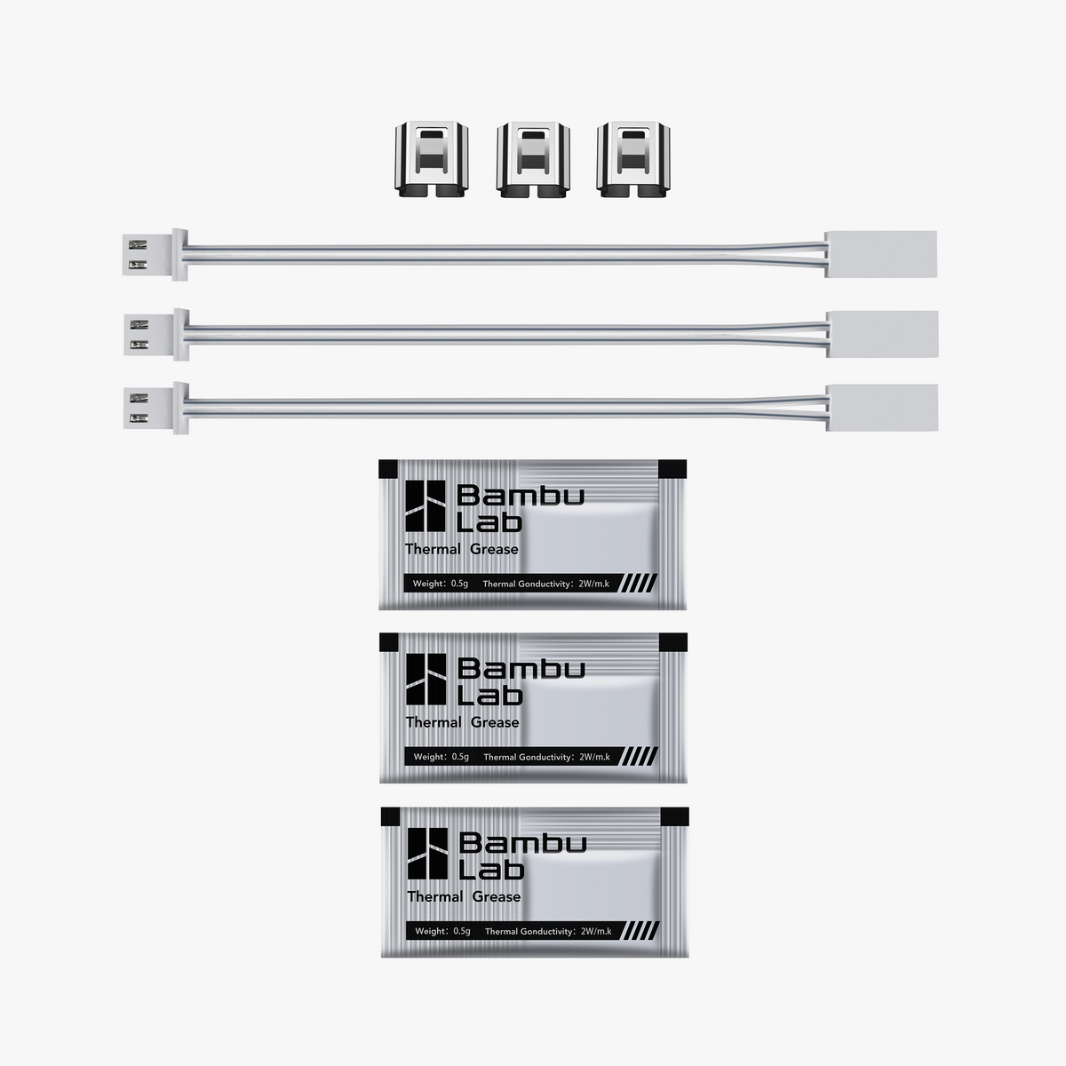 Set of three ceramic heater spare parts for Additronix X1C, used in heating appliances, with visible ceramic components and electrical connectors.