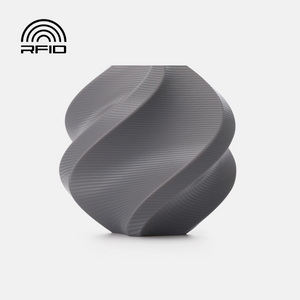 Additronix Bambu Lab PETG Basic grey filament spool for 3D printing, showcasing the textured grey filament on the spool.