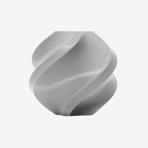 Gray Bambu Lab PC FR filament from Additronix, shown in a spool with smooth, high-quality 3D printing material.