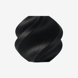 Additronix Bambu Lab PAHT-CF black filament spool for 3D printing, showing the filament roll against a neutral background.