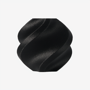 Additronix Bambu Lab PAHT-CF black filament spool for 3D printing, showing the filament roll against a neutral background.