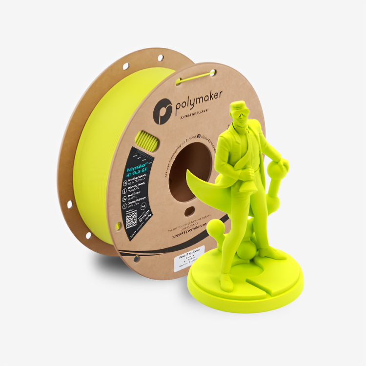 Additronix Polymaker HT-PLA-GF filament spool with green filament for 3D printing, shown with a power tool in the background.