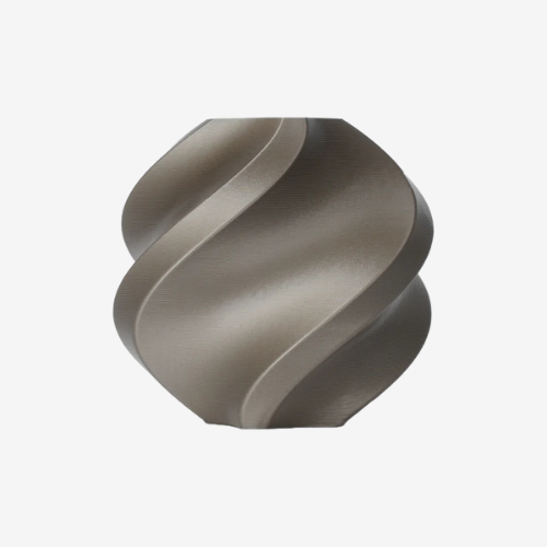 Additronix Bambu Lab PLA Metal filament in iridium gold metallic finish, showcasing the shiny, textured 3D printing filament.