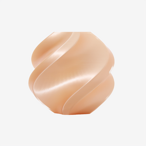 Additronix Bambu Lab PLA Silk+ filament in champagne color, showing the smooth, shiny spool of 3D printing filament.