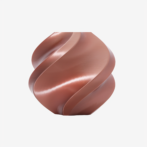 Additronix Bambu Lab PLA Silk+ filament in Rose Gold color, showcasing the spool with shiny, smooth silk finish material.