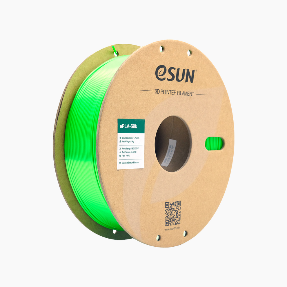 Additronix silver eSun PLA-Silk filament spool with shiny, smooth finish for 3D printing projects.